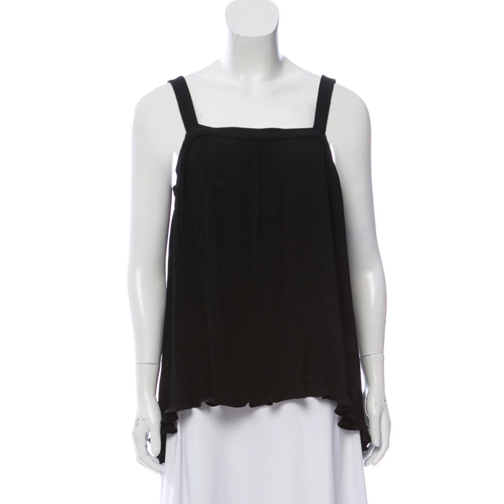 Black Co. plissé sleeveless top with square neckline and ruffle-accented hem.